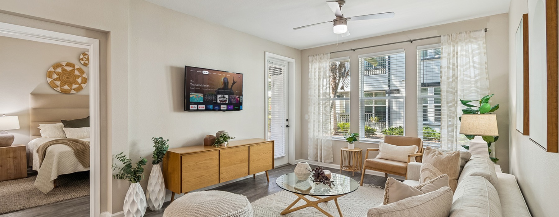 living room couch and chairs with table and tv Amelia at Westshore FL luxury apartments for rent