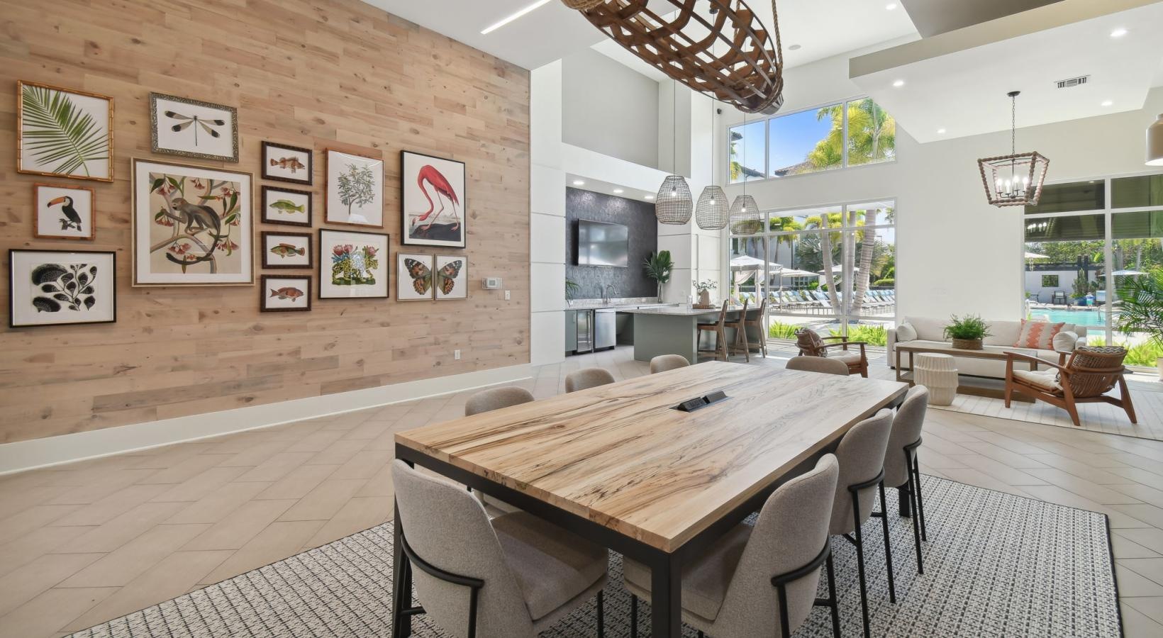 Find your perfect fit at Amelia Westshore a dining room with a chandelier and a table