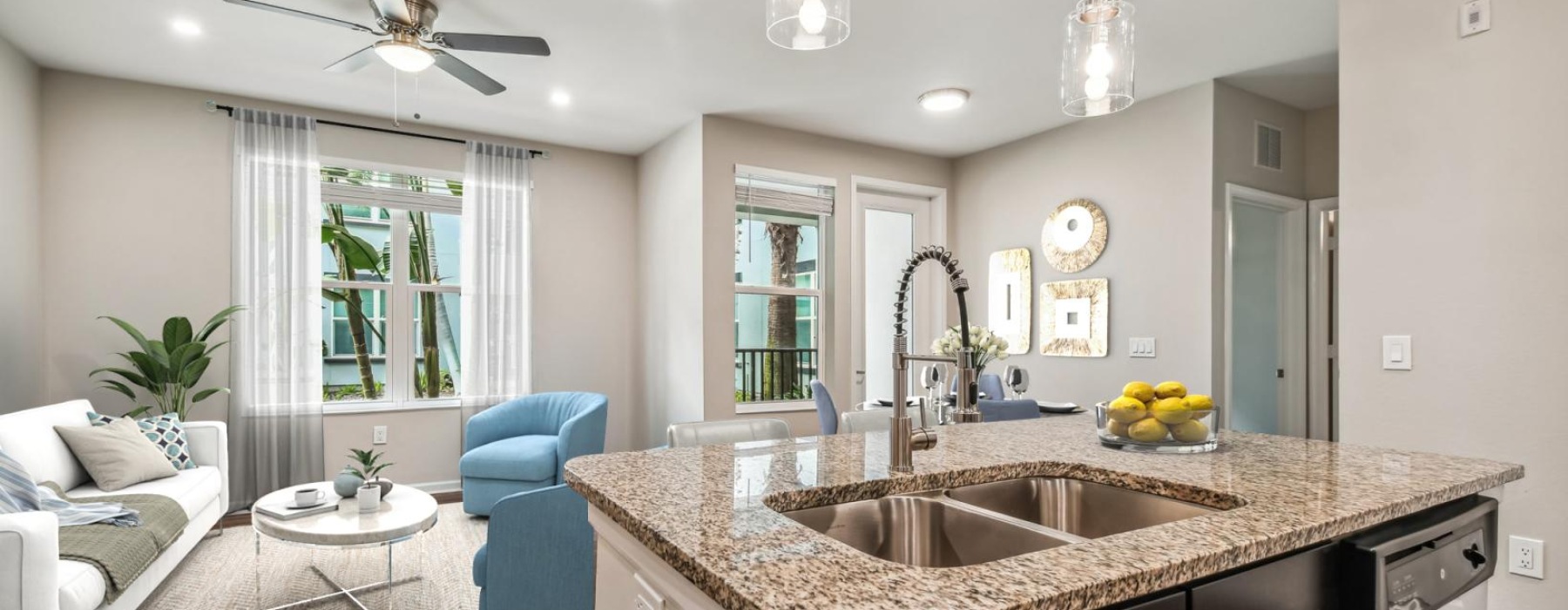 a large kitchen with a marble island