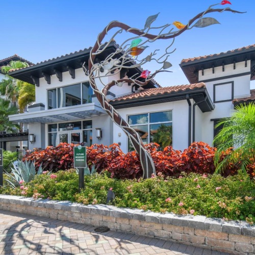 a building with a garden in front of it